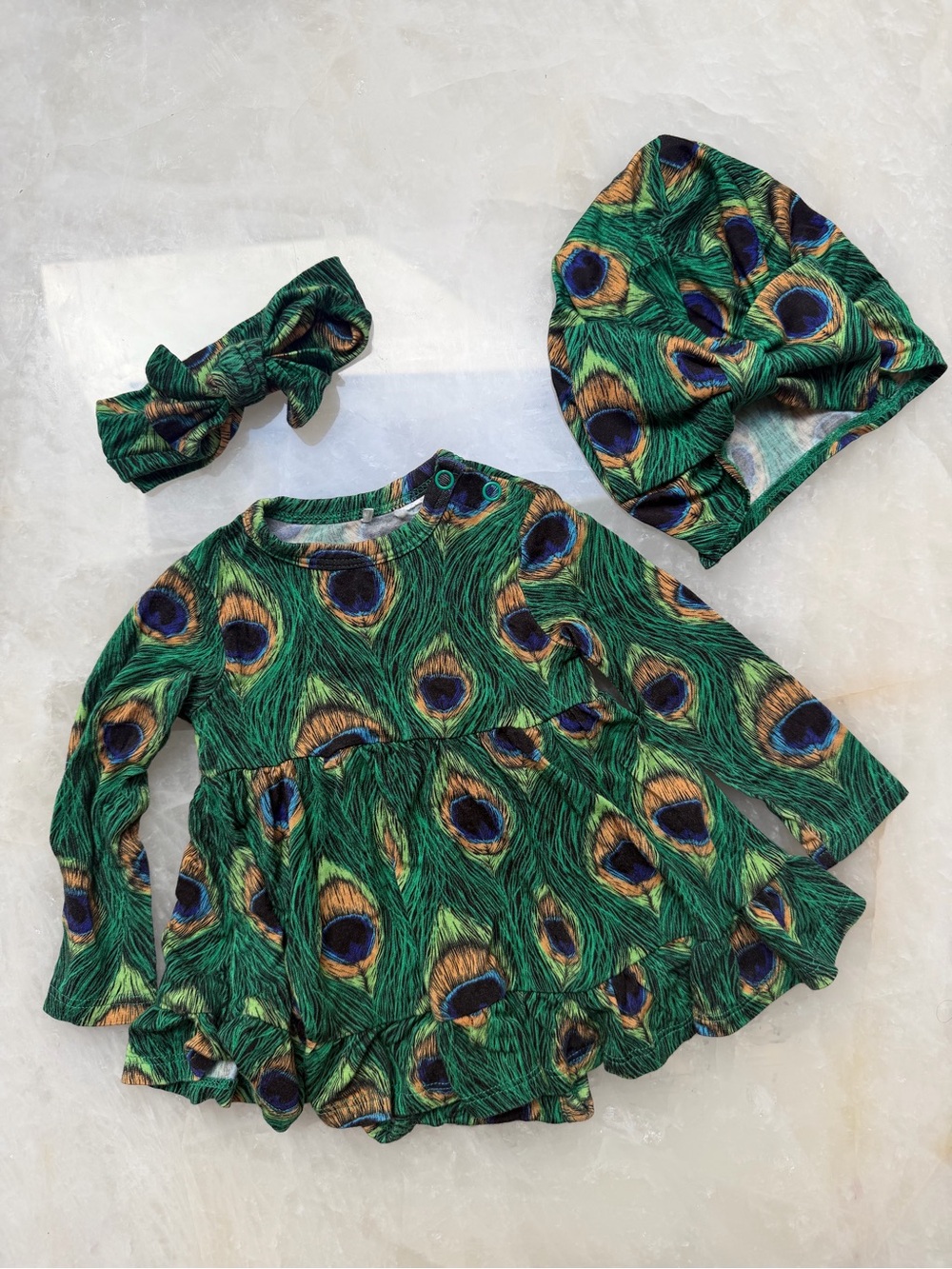 Posh Peanut twirl dress with matching hat and bow Peacock pattern